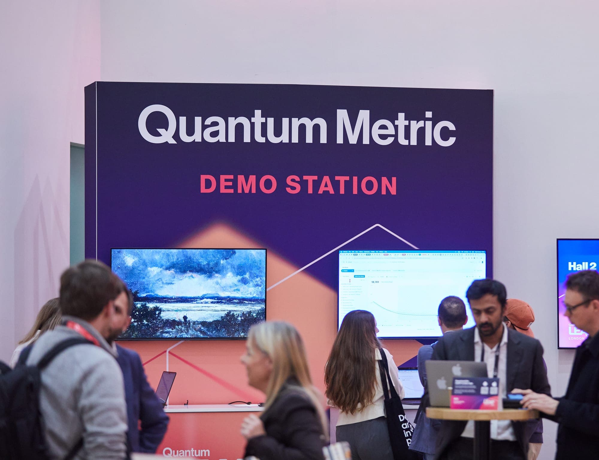 Quantum Metric demo station at LEAP London with attendees