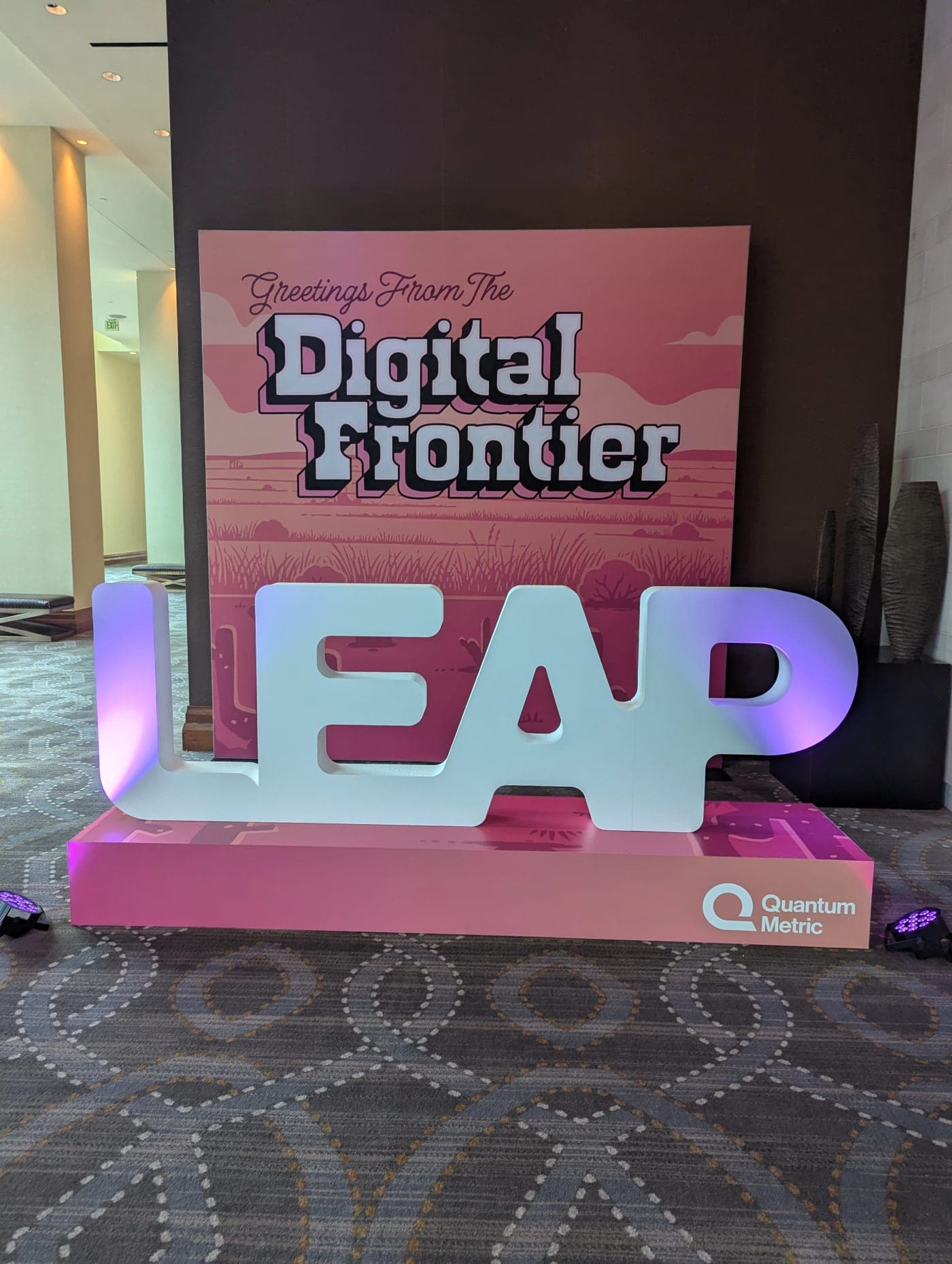 Greetings From The Digital Frontier sign with a large LEAP letter sculpture